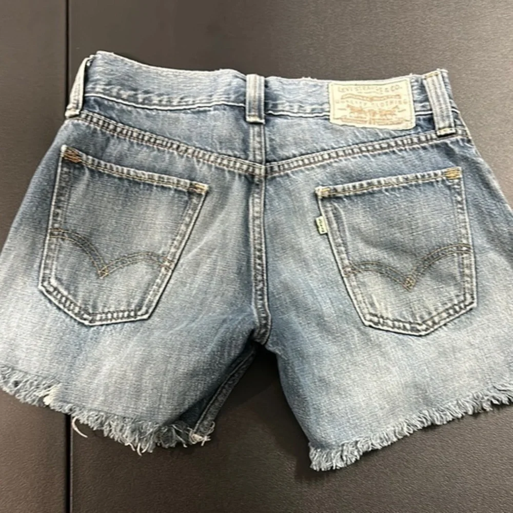Levi's Women's Blue Frayed and faded Denim Shorts size 30 waist